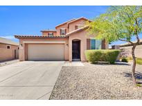 Charming two-story home with a well-maintained front yard, large driveway and a two car garage at 314 N 79Th Pl, Mesa, AZ 85207