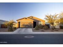 Charming single-story home featuring a well-maintained front yard and a two-car garage at 3982 E Sidesaddle Rd, San Tan Valley, AZ 85140