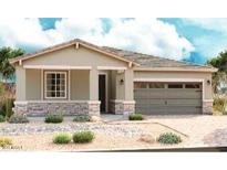 Charming single-story home featuring a two-car garage, stone accents, neutral paint, and desert landscaping at 40546 W Michaels Dr, Maricopa, AZ 85138