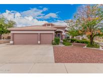 Charming single-story home featuring a three-car garage and desert landscaping at 5031 W Ivanhoe St, Chandler, AZ 85226