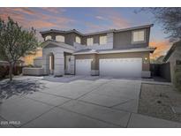 Beautiful two-story home with three-car garage and well-manicured front yard at 7317 W Southgate Ave, Phoenix, AZ 85043