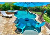 Inviting backyard pool and spa area, perfect for relaxation and entertaining at 7567 W Andrea Dr, Peoria, AZ 85383