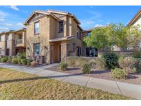 Charming two-story home featuring desert landscaping, stucco siding and a welcoming entryway at 857 S Osborn Ln, Gilbert, AZ 85296