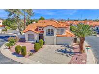 Beautiful home with a terra cotta roof, two-car garage, balcony, and well-maintained landscaping at 12407 N 54Th Ave, Glendale, AZ 85304