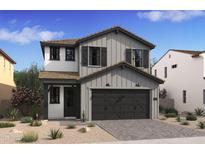 Charming two-story home featuring neutral siding, a two-car garage, and a covered entryway at 2401 W Los Arboles Pl, Chandler, AZ 85224