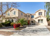 Stately two-story home boasts meticulous landscaping and a grand driveway, perfect for luxurious living at 2830 E Janelle Way, Gilbert, AZ 85298