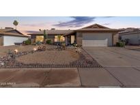 Charming single-story home with desert landscaping and a two-car garage at 5434 W Golden Ln, Glendale, AZ 85302