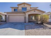 Charming two-story home with a well-maintained front yard and attached two-car garage at 9939 W Southgate Ave, Tolleson, AZ 85353