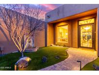 Inviting front entrance featuring a decorative door, stone walkway, and tranquil water feature at 30600 N Pima Rd # 49, Scottsdale, AZ 85266