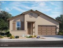 Charming single-story home with a stucco exterior, covered entry, two car garage and desert landscaping at 41935 W Hospitality Ln, Maricopa, AZ 85138