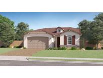 Charming single-story home features a two-car garage, desert landscaping, and a tile roof at 20897 S 231St Pl, Queen Creek, AZ 85142
