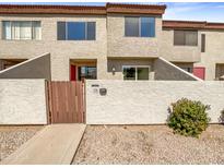 Inviting townhouse features a private courtyard, offering a charming and secure entrance at 2121 S Pennington -- # 58, Mesa, AZ 85202