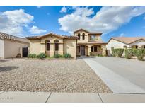 Charming two-story home features desert landscaping and a long, paved driveway at 21366 E Alyssa Rd, Queen Creek, AZ 85142