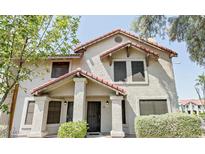 Charming two-story home featuring a red tile roof and well-maintained landscaping at 6262 E Brown Rd # 30, Mesa, AZ 85205
