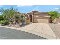 Stunning single-story home with desert landscaping, neutral stucco, and a tile roof at 7544 E Sierra Morena Cir, Mesa, AZ 85207