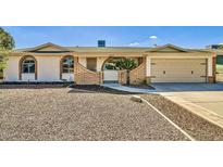 Charming single-story home with a well-maintained front yard and a two-car garage at 1257 W Dublin St, Chandler, AZ 85224