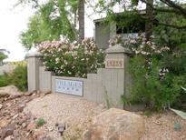 Beautiful community entrance featuring well-maintained landscaping and attractive signage at 15225 N 100Th St # 1220, Scottsdale, AZ 85260