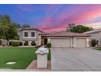 Charming two-story home featuring a tile roof, well-manicured lawn and three-car garage at 2321 N Glenview --, Mesa, AZ 85213
