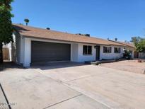 Charming single-story home featuring a spacious driveway and attached two-car garage at 4225 W Echo Ln, Phoenix, AZ 85051