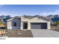 Charming single-story home featuring desert landscaping, a two-car garage and stylish architectural accents at 5771 E Axle Ln, San Tan Valley, AZ 85140