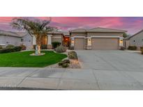 Charming home showcasing a lush front yard with a beautiful palm tree and manicured landscaping at 6751 S Callaway Dr, Chandler, AZ 85249