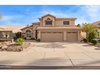 Charming two-story home with a three-car garage, desert landscaping and tile roof at 1333 E Rockledge Rd, Phoenix, AZ 85048