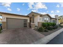 Charming single-story home boasts a modern design, well-manicured landscaping, and a spacious two-car garage at 20739 W Reade Ave, Buckeye, AZ 85396