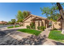 Inviting single-Gathering home with a well-kept lawn, desert landscaping, and a two-car garage at 32 E Dawn Dr, Tempe, AZ 85284