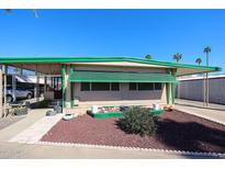 Charming home featuring front patio, carport, and desert landscaping for relaxed outdoor living at 7300 N 51St Ave # G142, Glendale, AZ 85301