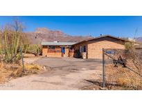 Quaint brick home with mountain views and desert landscaping at 765 S Geronimo Rd, Apache Junction, AZ 85119