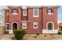 Charming two-story home with terracotta-colored stucco and well-maintained landscaping at 924 E Redondo Dr, Gilbert, AZ 85296