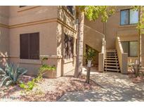 Inviting home exterior with well-manicured landscaping and direct access to stairway at 15252 N 100Th St # 1151, Scottsdale, AZ 85260