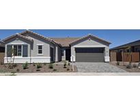 Charming single story home with a two car garage, stone landscaping and a low maintenance desert yard at 24134 N 172Nd Ave, Surprise, AZ 85387