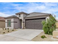 Well-maintained one story home featuring a two car garage and a desert landscaped front yard at 24408 W Ripple Rd, Buckeye, AZ 85326