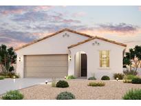 Charming single-story home boasting a stucco facade, tile roof, arched entryway, and a meticulously xeriscaped front yard at 2514 E Music Mountain Ave, Apache Junction, AZ 85119
