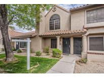 Inviting two-story townhome showcasing a well-manicured lawn and beautiful Southwestern architectural design at 3491 N Arizona Ave # 167, Chandler, AZ 85225