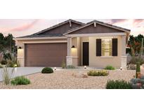 Charming single-story home featuring a two-car garage and desert landscaping at 4425 S Siphon Draw Rd, Apache Junction, AZ 85119