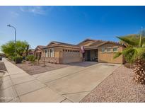 Well-kept single-Gathering home boasting a xeriscaped front yard and a spacious two-car driveway at 6822 W Alta Vista Rd, Laveen, AZ 85339