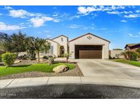 Charming single-story home featuring a well-maintained yard and a spacious two-car garage at 16987 W Princeton Ave, Goodyear, AZ 85395