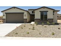 Charming single-Gathering home with a two-car garage and desert landscaping at 5508 N 192Nd Ave, Litchfield Park, AZ 85340