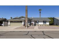 Charming single-story home featuring a two-car garage and low-maintenance landscaping at 1946 E Wesleyan Dr, Tempe, AZ 85282