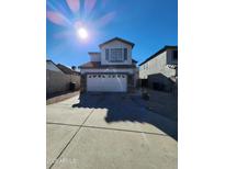 Charming two-story home with a well-maintained front yard and attached two-car garage under a bright, sunny sky at 2143 N 30Th St, Mesa, AZ 85213