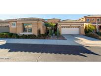 Inviting home featuring a desert landscape, tile roof, and a convenient two-car garage at 2325 W Mineral Rd, Phoenix, AZ 85041