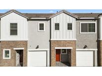 Charming townhome showcasing a blend of brick and modern siding, complemented by a convenient garage and inviting entry at 2832 W Eagle Talon Rd, Phoenix, AZ 85085