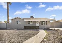 Charming single-story home features a low maintenance front yard and welcoming entrance walkway at 2921 W Luke Ave, Phoenix, AZ 85017