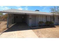 Charming single-story home with a covered carport and well-maintained landscaping in a suburban neighborhood at 3347 E Palm Ln, Phoenix, AZ 85008