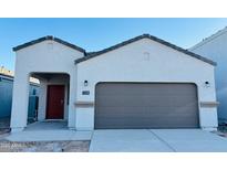 Charming single-Gathering home showcasing a clean exterior with a two car garage and covered front porch at 5123 E Umber Rd, San Tan Valley, AZ 85143