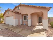 Inviting front entrance with charming architectural details and low-maintenance landscaping at 5819 S 10Th St, Phoenix, AZ 85040