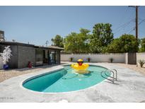 Outdoor pool with a cute yellow rubber ducky and gray tiled surround at 6326 N 86Th N St, Scottsdale, AZ 85250