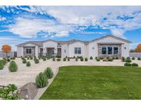 Beautiful single-story home featuring a modern design, manicured landscaping and stone accents at 13929 E Barwick Dr, Scottsdale, AZ 85262